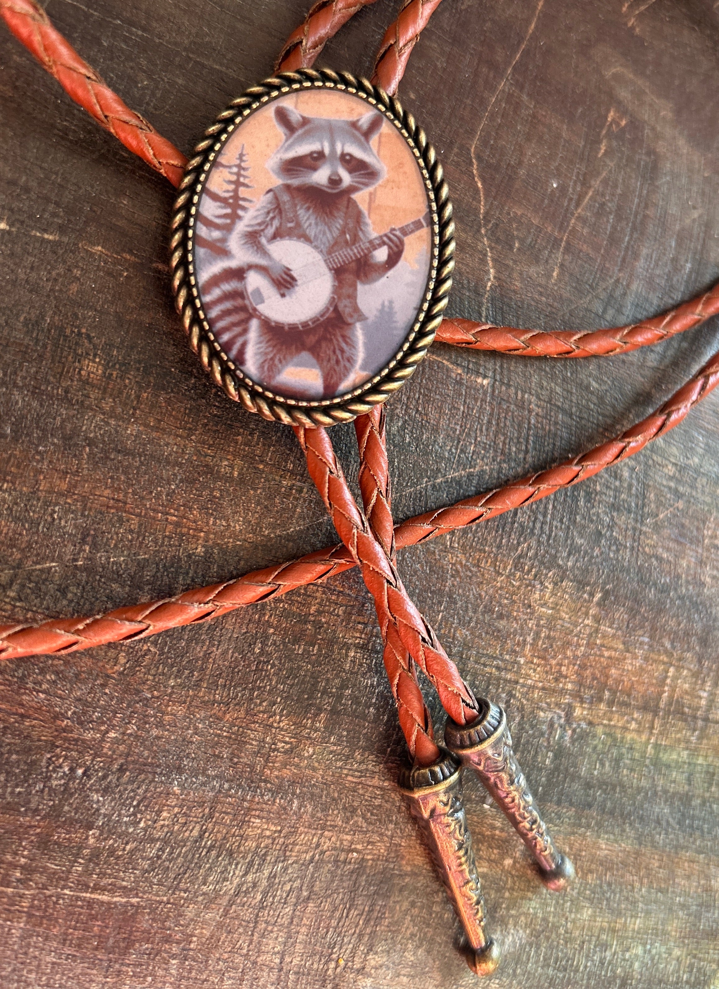 Banjo Raccoon Bolo Tie - cream background