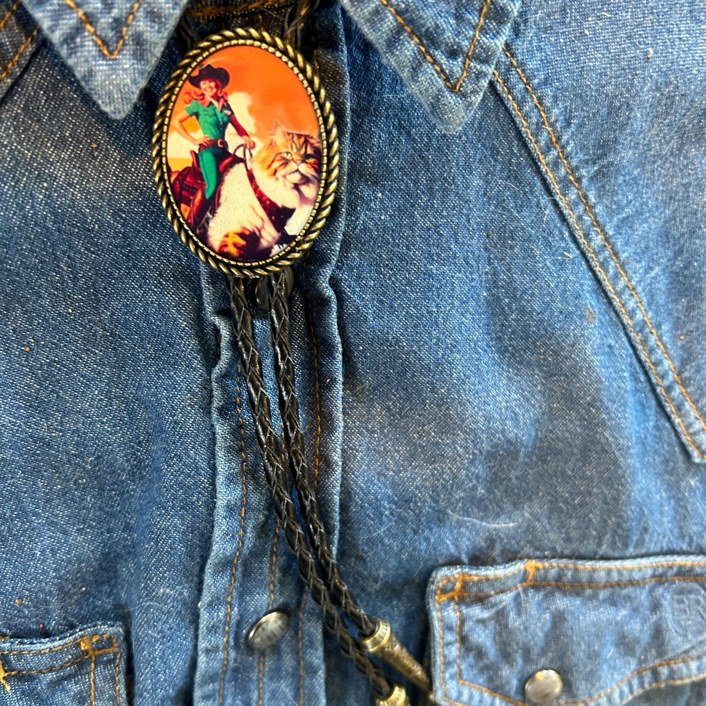 Cowgirl Riding Cat Bolo Tie